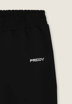 Freddy Pantaloni slim in interlock con dettagli lucidi-Uomo Pantaloni Sportivi