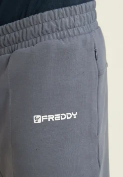 Freddy Pantaloni slim in interlock con dettagli lucidi-Uomo Pantaloni Sportivi