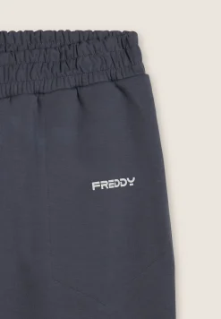 Freddy Pantaloni slim in interlock con dettagli lucidi-Uomo Pantaloni Sportivi