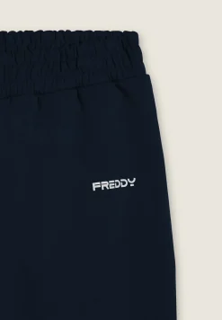 Freddy Pantaloni slim in interlock con dettagli lucidi-Uomo Pantaloni Sportivi