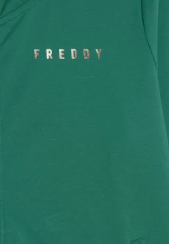 Freddy Tuta donna con zip, collo alto e spacchi laterali su fondo gamba-Donna Tute